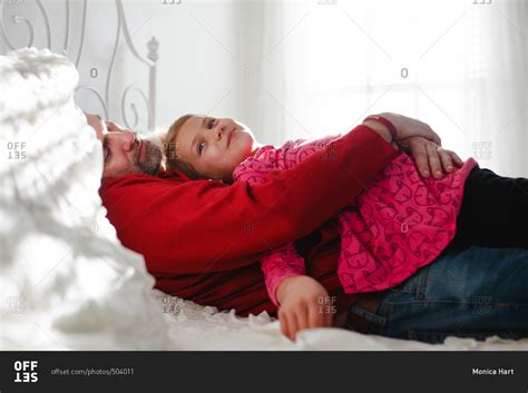 dad and daughter sharing bed